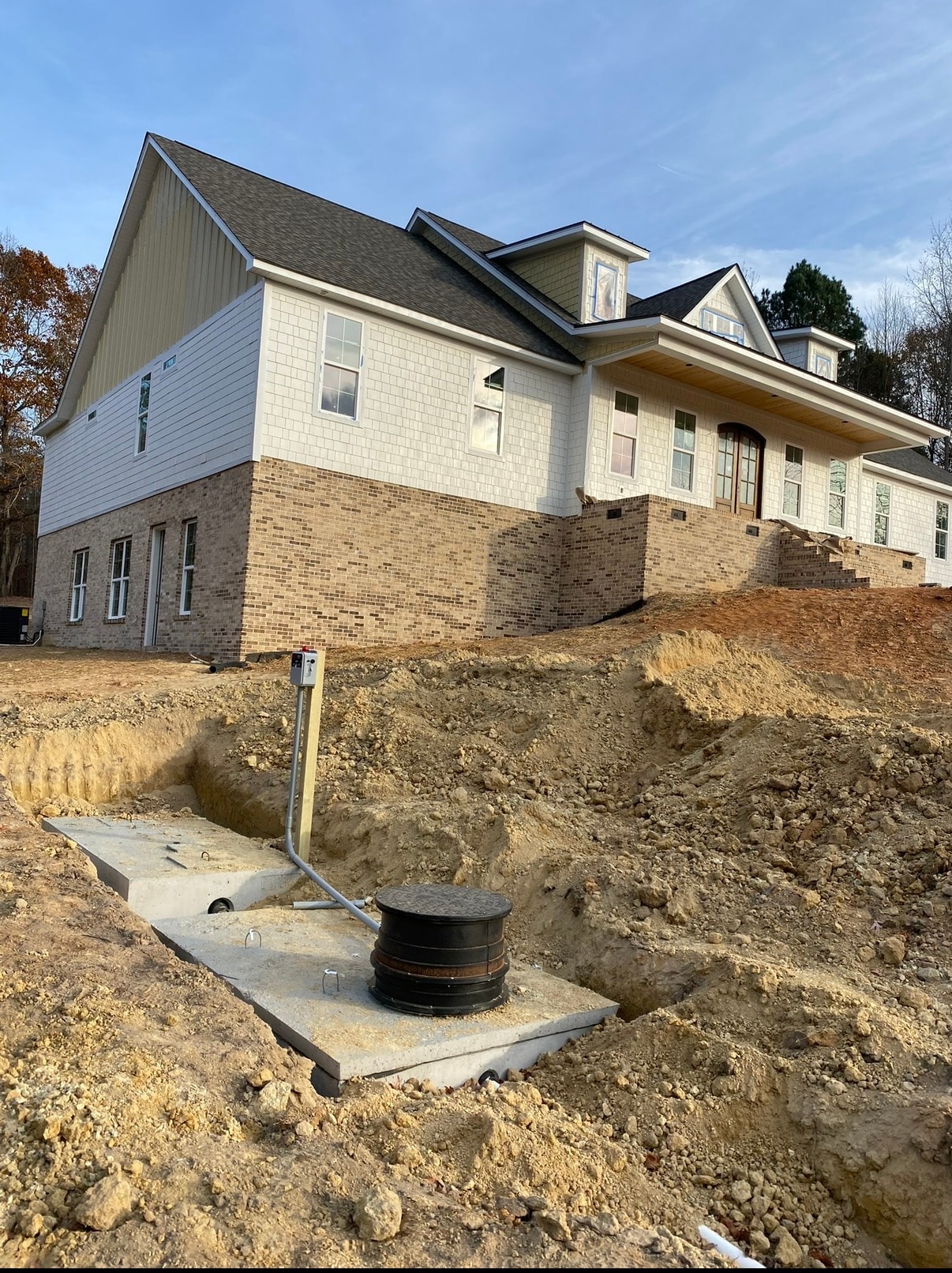 Septic tank installation at new home construction site
